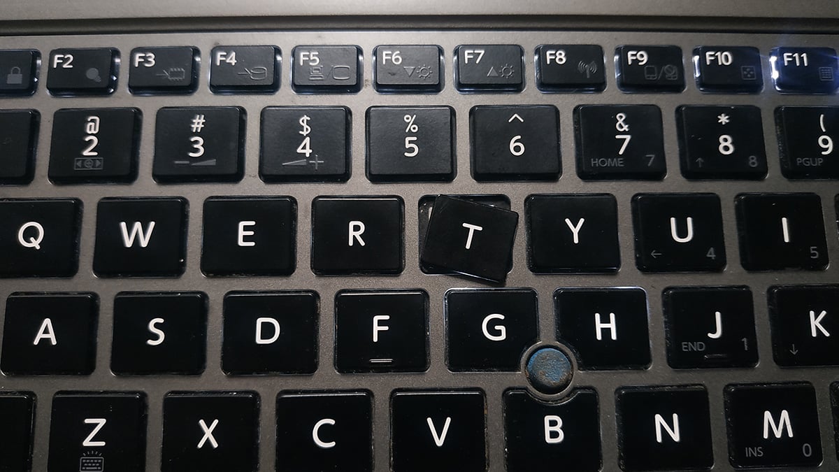 Inspect the laptop keyboard for any visible dirt, dust, or spills.
If there are any crumbs or debris, gently turn the laptop upside down and tap on the back to dislodge them.