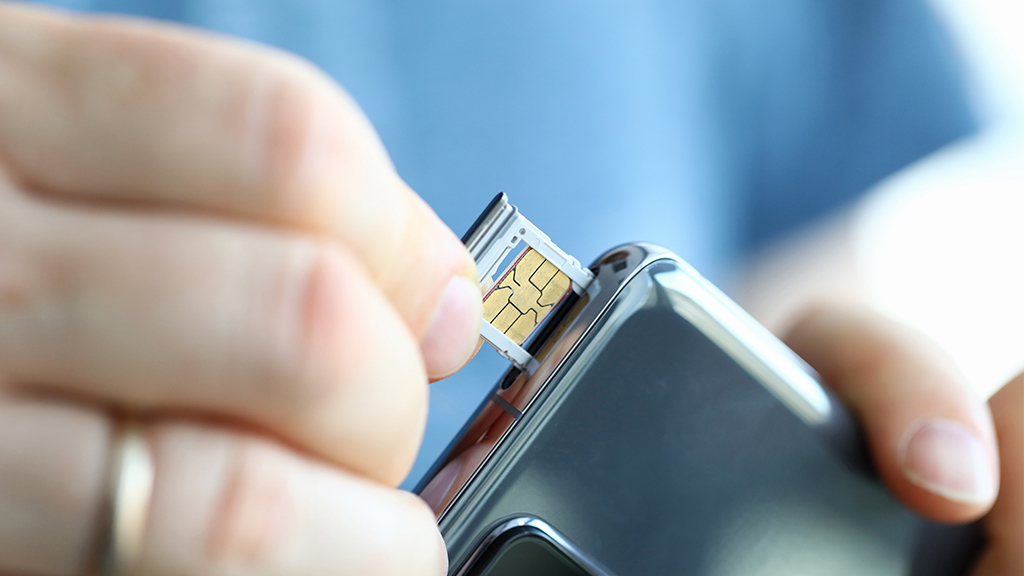 Power off the phone and remove the SIM card tray.
Inspect the SIM card for any visible damage or dirt.