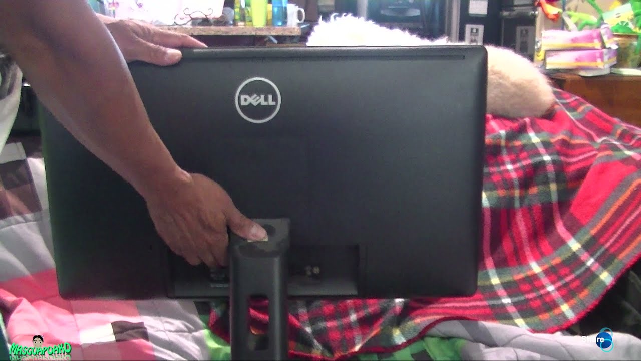 Remove the Dell monitor from its current stand or arm, if necessary.
Locate the VESA mounting holes on the back of the monitor.